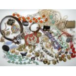 A collection of vintage costume jewellery to include, a large clan Gordon badge, Trifari earrings,