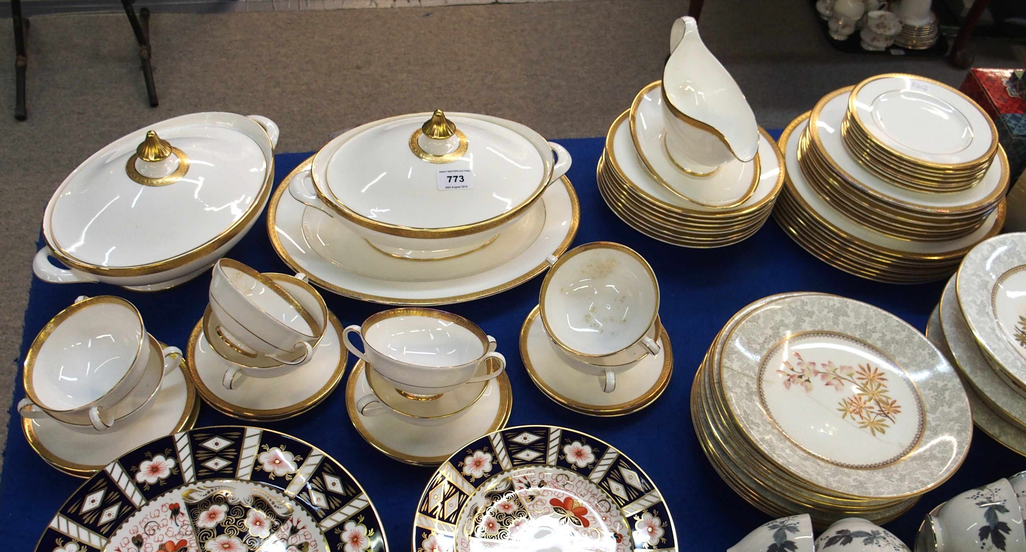 Royal Doulton Royal Gold pattern dinner service comprising; platter, two tureens, eight soup coups