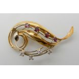 An 18ct gold ruby and diamond brooch, diamond content estimated approx 0.34cts, length 5.2cm, weight