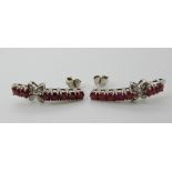 A pair of silver ruby and diamond drop earrings, length 2.5cm, stamped 925 Condition Report: