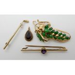 A 14ct gold green hardstone set brooch length 5.6cm, weight 5.5gms, a 15ct gold and pearl gold