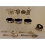 A lot comprising a three piece silver condiment set, a pair of silver salts, a single silver salt