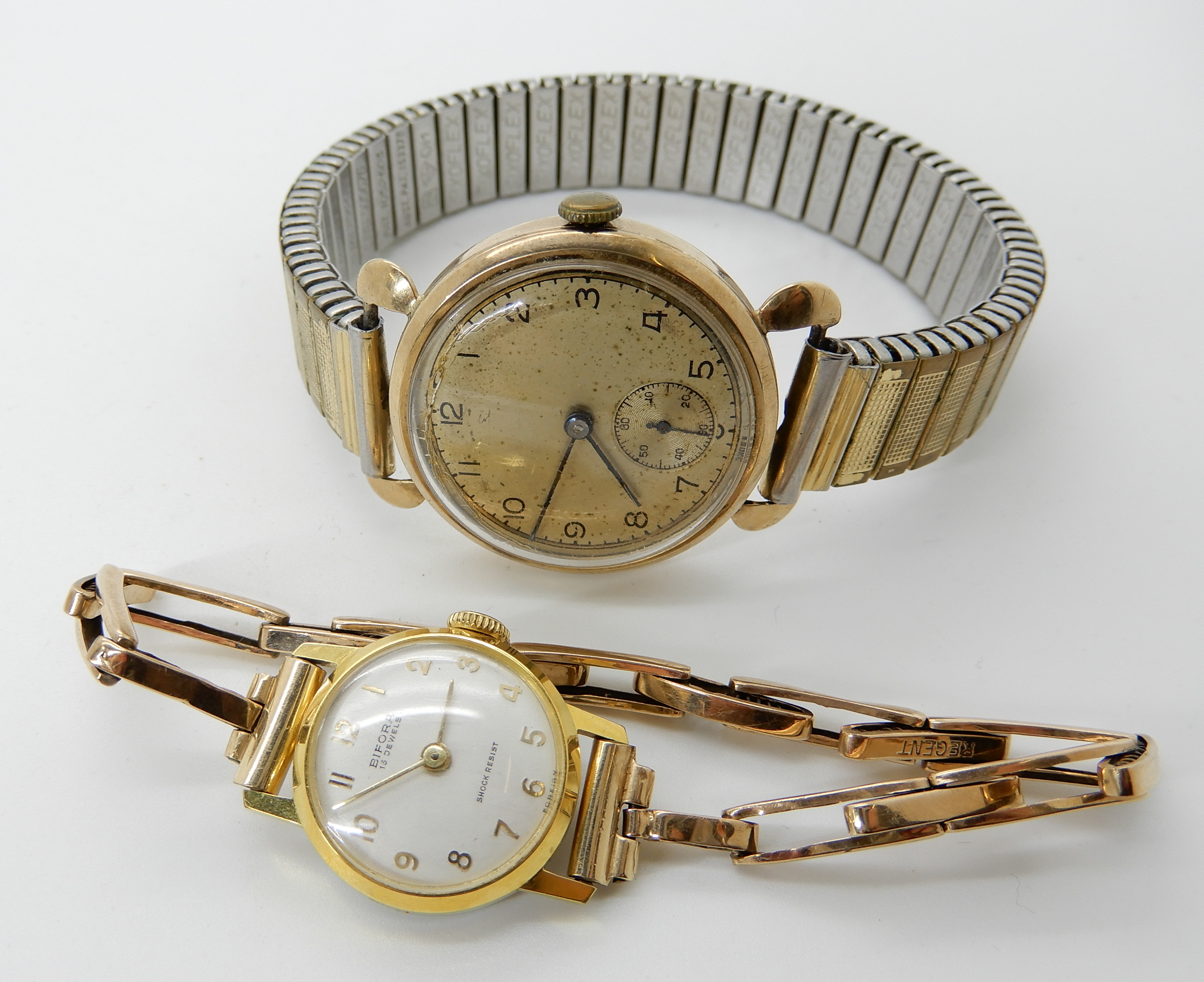 A 9ct gold gents vintage watch with gold plated strap together with a ladies Bifora watch with 9ct