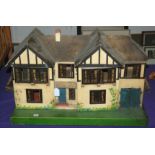A vintage Triang dolls house, 68cm wide Condition Report: Available upon request