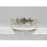 An 18ct gold and platinum three stone diamond ring of estimated approx 0.20cts, size J, weight 1.