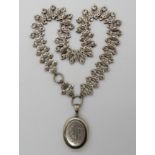 A Victorian white metal locket and chain Condition Report: Not available for this lot