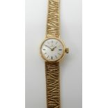 A 9ct gold ladies Omega wristwatch with integral woven bracelet, length 16cm, weight 18.6gms