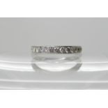 A Chisholm Hunter platinum diamond set half eternity ring, estimated approx diamond content 0.25cts,
