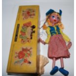 A Pelham Dutch Girl puppet in original box, soft toy and money bank Condition Report: Available upon