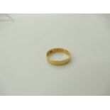 An 18ct gold wedding band, size P, weight 2.4gms Condition Report: Available upon request