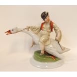A Herend porcelain figure boy on a swan, impressed number to base 5515, 20cm high Condition