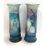 A pair of Royal Doulton porcelain vases with turquoise transfer printed Dutch scenes, 23.5cm high