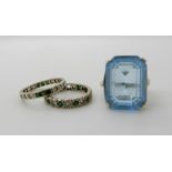 A 9ct gem set full eternity ring, another in yellow metal and a silver blue gem set ring Condition