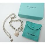 A silver bracelet stamped Tiffany and a silver pendant and chain Condition Report: Not available for