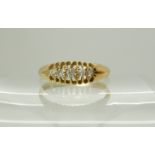 An 18ct gold five stone diamond ring, size P, weight 2.4gms Condition Report: Available upon