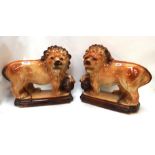 A pair of Bo'Ness pottery lions Condition Report: Available upon request