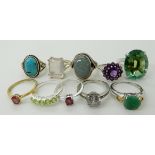 A collection of silver and white metal rings to include, mermaid mystic topaz, ruby, peridot etc