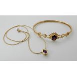 A 9ct gold garnet bangle, and a 9ct amethyst pendant and chain length 42cm approx, weight for both