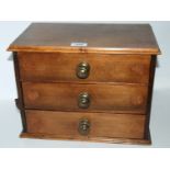 A miniature three drawer chest with carved mouse, 36 x 26cm Condition Report: Available upon
