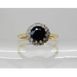 An 18ct gold sapphire and diamond ring, size M1/2, weight 2.8gms Condition Report: Available upon