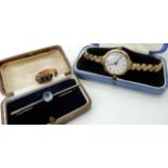 A 9ct cased ladies vintage watch, a 9ct gold blue gem brooch and a yellow metal gem set ring (af)