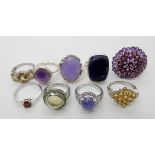 A collection of silver and white metal rings to include, lilac hardstone, amethyst, citrine etc