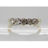 An 18ct gold five stone diamond ring, set with estimated approx 0.50cts of old brilliant cut