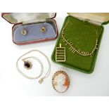 A 9ct gold fringe necklace, length 37cm, a 9ct abacus pendant, length 2.8cm, a 9ct garnet pendant