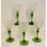 A set of five Webb cut glass glasses with green stems Condition Report: Available upon request