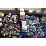 A collection of Eeyore figures including Simply Pooh examples, money box, trinket boxes, bouquets