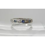 An 18ct white gold sapphire and diamond half eternity ring, size N, weight 2.7gms Condition