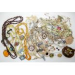 A collection of vintage costume jewellery to include beads, brooches etc Condition Report: Not