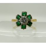 An 18ct cz and emerald flower ring, size N, weight 3.7gms Condition Report: Available upon request