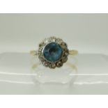 A bright yellow metal aquamarine and diamond cluster ring, size J, weight 1.9gms Condition Report: