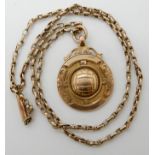 A 9ct gold football medallion with a 9ct vintage chain, length of chain 48cm, weight 11gms Condition