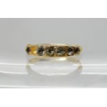 A 22ct gold ring set with clear gems, size L1/2, weight 2.3gms Condition Report: Available upon