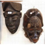 Two African wooden wall masks Condition Report: Available upon request