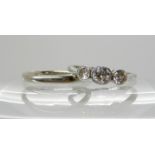 An 18ct white gold and platinum three stone diamond ring, the diamonds estimated approx 0.55cts,