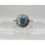 A 9ct gold blue and white zircon cluster ring, size M, weight 2.9gms Condition Report: Available