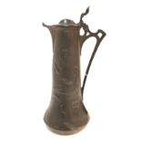 Pewter Art Nouveau claret jug decorated with repousse flowers Condition Report: Available upon
