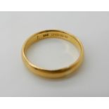 A 22ct gold wedding ring, size O1/2, weight 4.1gms Condition Report: Available upon request