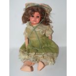 A 20th Century German doll, 60cm high Condition Report: Available upon request