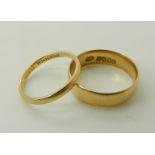 A 18ct gold Glasgow hallmarked wedding band, size M, together with another size J1/2, weight