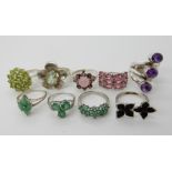 A collection of silver and white metal rings to include, amethyst apatite, peridot etc Condition