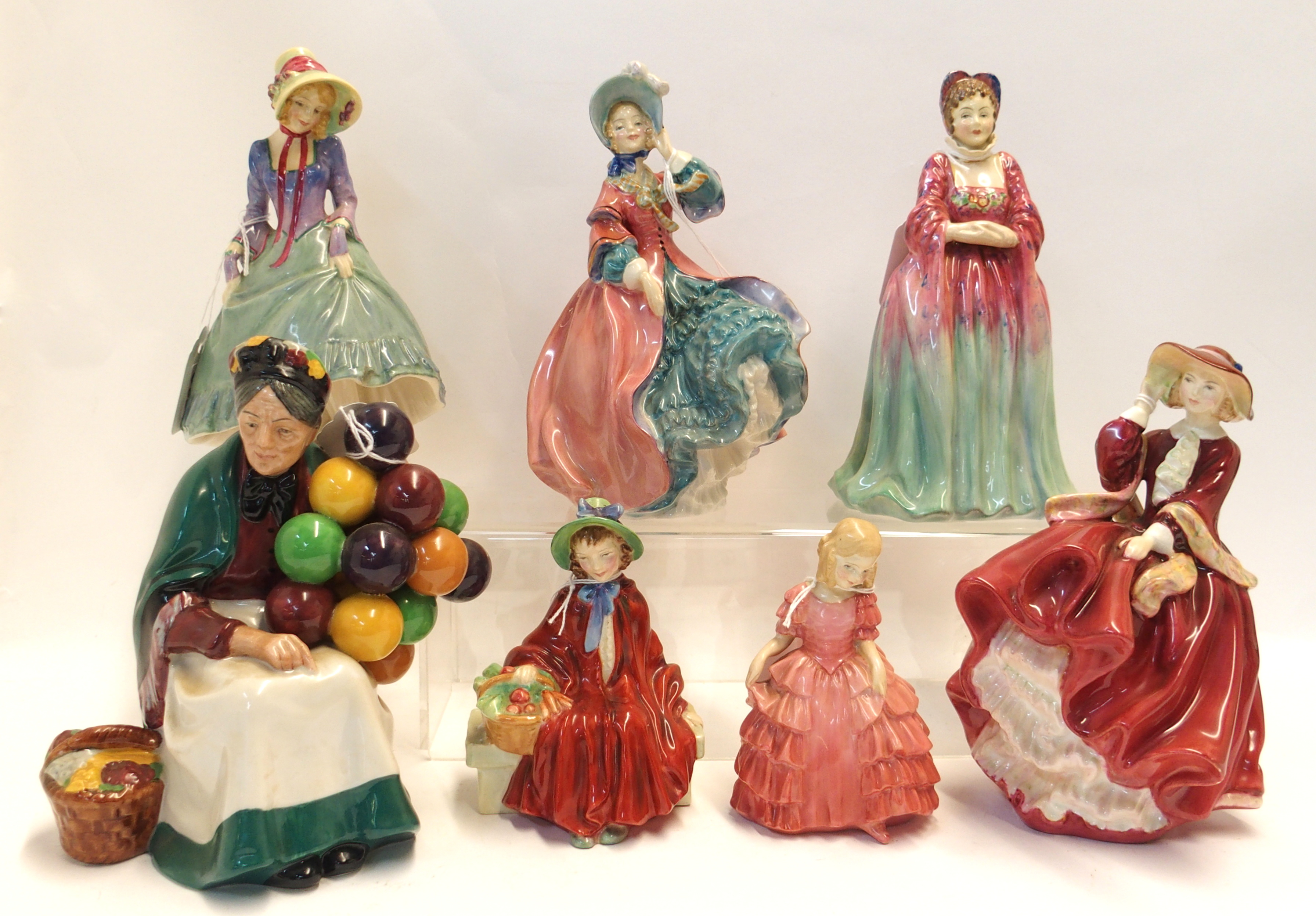 Six Royal Doulton figures including Pantalettes, Spring Morning, The Old Balloon Seller, Top O the