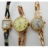 An 18ct cased ladies Edward of Glasgow watch with 9ct strap, a 9ct ladies vintage watch and strap