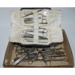 A collection of surgical tools including tonsil kit Condition Report: Available upon request