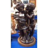 A bronze group of two children, 42cm high Condition Report: Available upon request