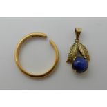 An 18ct gold pendant set with a synthetic star sapphire, length 2.2cm, weight 1.2gms together with a