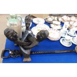 A figural stand and an ebonised walking cane (handle damaged) Condition Report: Available upon